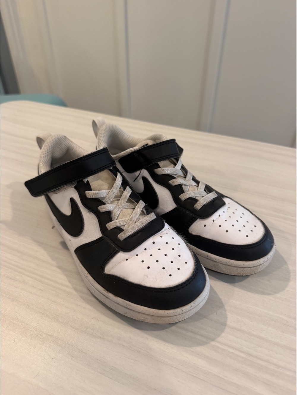 Nike black and white kids low top sneakers